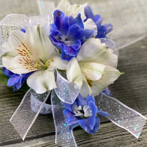 Blue and white corsage