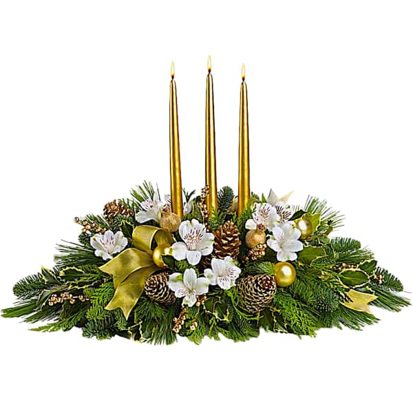 Holiday centerpiece with three gold candles and white flowers