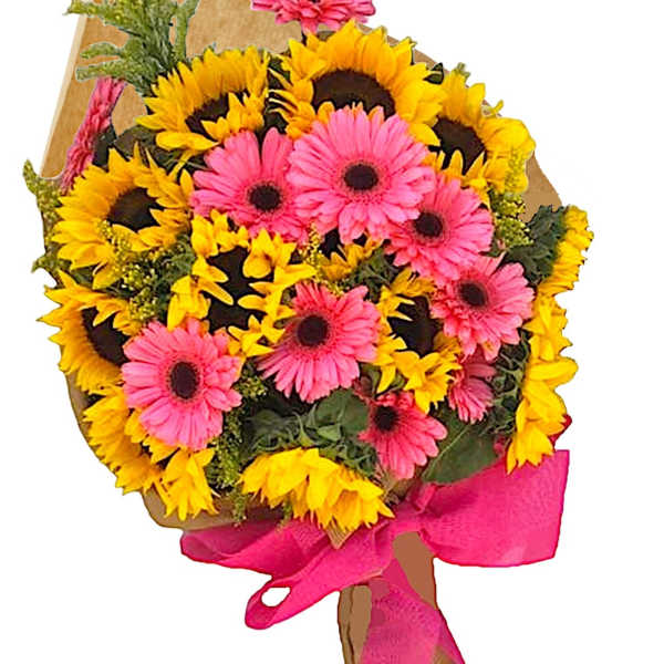 Bouquet of pink gerbera daisies and yellow sunflowers wrapped in brown paper with a pink ribbon