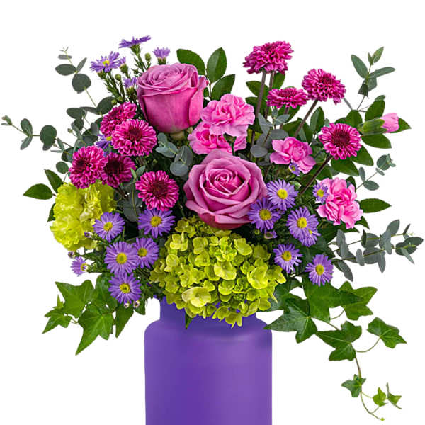 Pink and purple flower arrangement in a purple vase