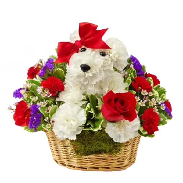 Teddy bear made of white flowers in a basket with red roses and a red bow