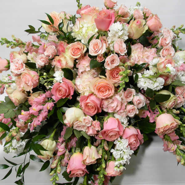 Large bouquet of pink and white roses with mixed blooms