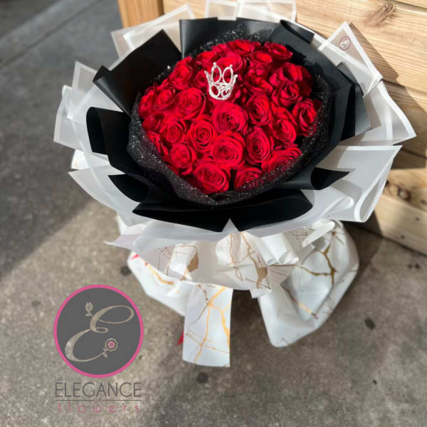 Bouquet of red roses wrapped in black and white paper