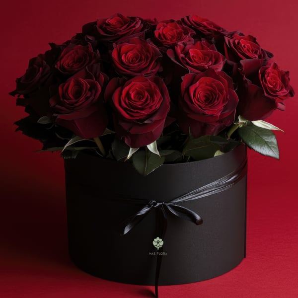 Bouquet of deep red roses in a black round box