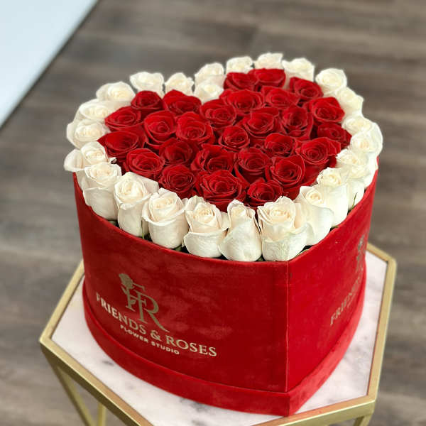 Heart-shaped box of red and white roses