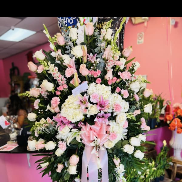 Large standing floral spray with pink and white roses and lilies