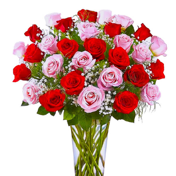 Bouquet of red and pink roses in a clear glass vase
