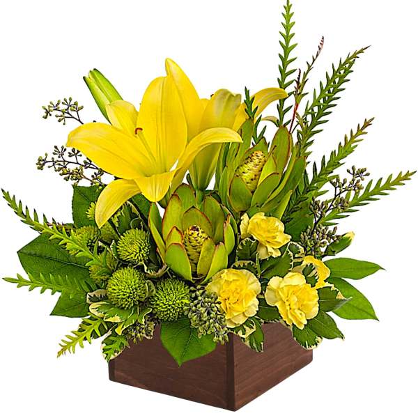 Yellow lilies and green blooms arranged in a wooden box