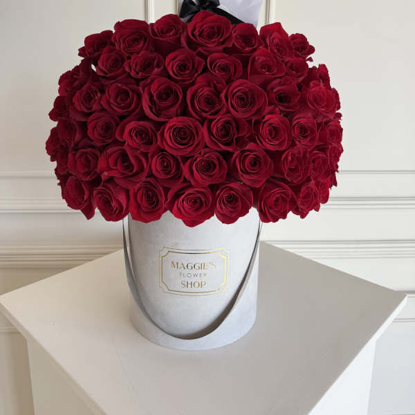 Large bouquet of red roses in a white hat box