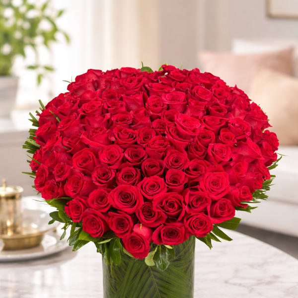 Large bouquet of red roses in a glass vase