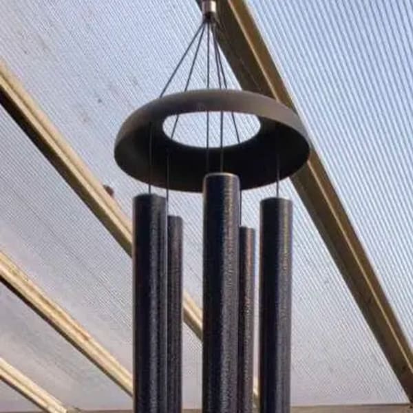 Black hanging wind chime with long tubular pipes