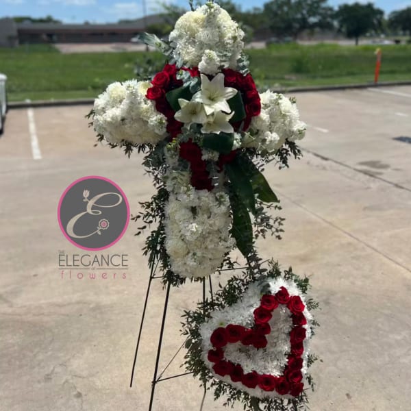 Standing floral tribute with red roses and white flowers on easels