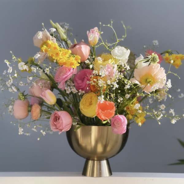 Mixed pastel bouquet in a gold vase