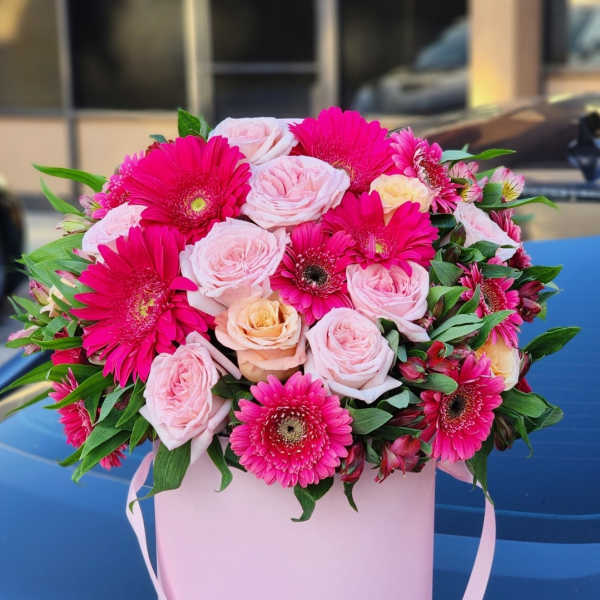 Pink and hot pink bouquet in a pale pink box