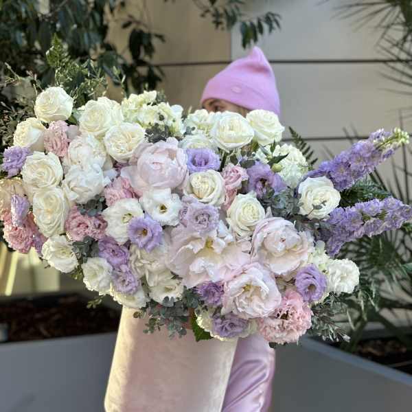 Large pastel bouquet of white, pink, and lavender flowers in a blush box