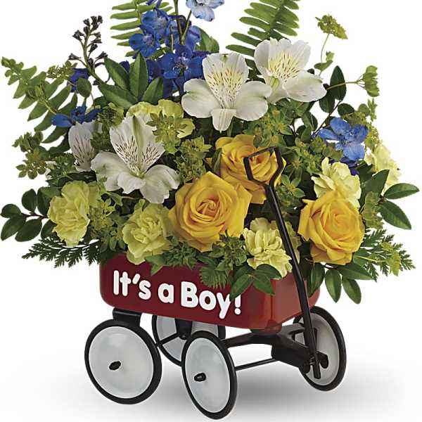 Flower arrangement in a red wagon with "It's a Boy!" text