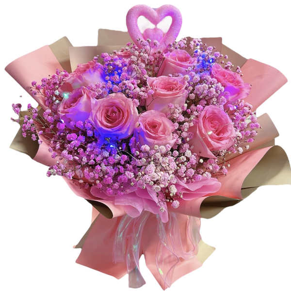 Pink rose bouquet with baby’s breath and a heart topper