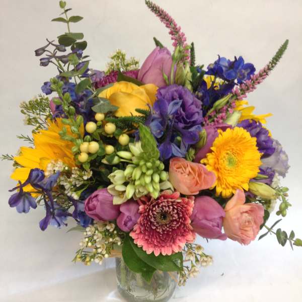 Colorful mixed bouquet in a clear glass vase