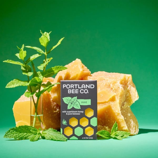 Mint soap bar box with fresh mint sprigs and honey-colored soap pieces