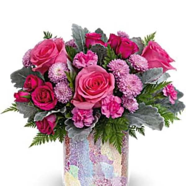 Pink roses and carnations in a mosaic glass vase