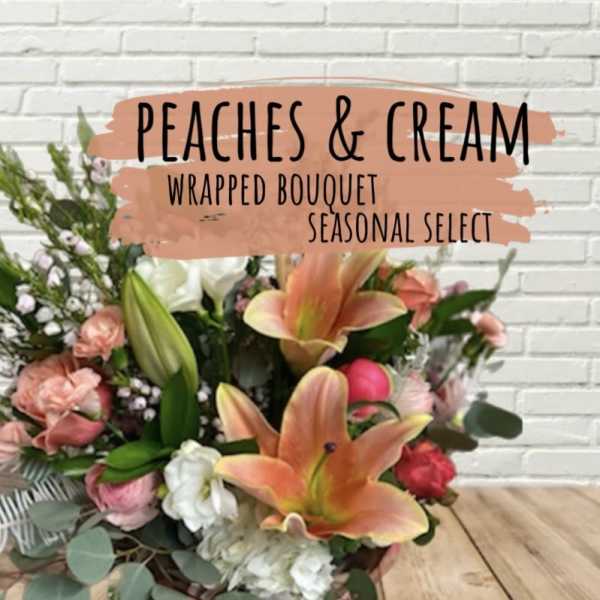 Peach and cream wrapped bouquet with lilies and roses