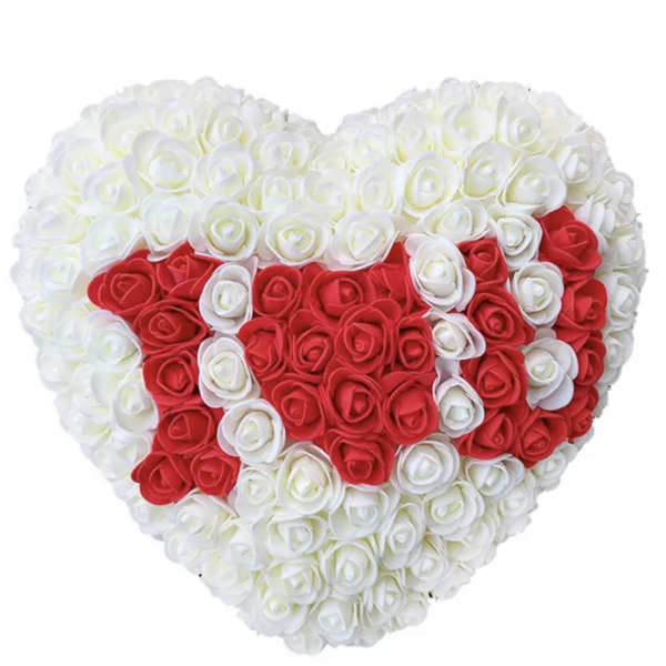 Heart-shaped arrangement of red and white roses