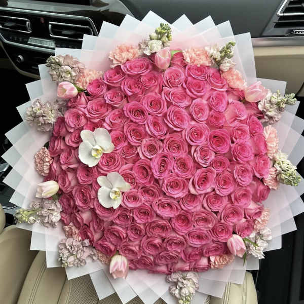 Large bouquet of pink roses with white orchids and tulips