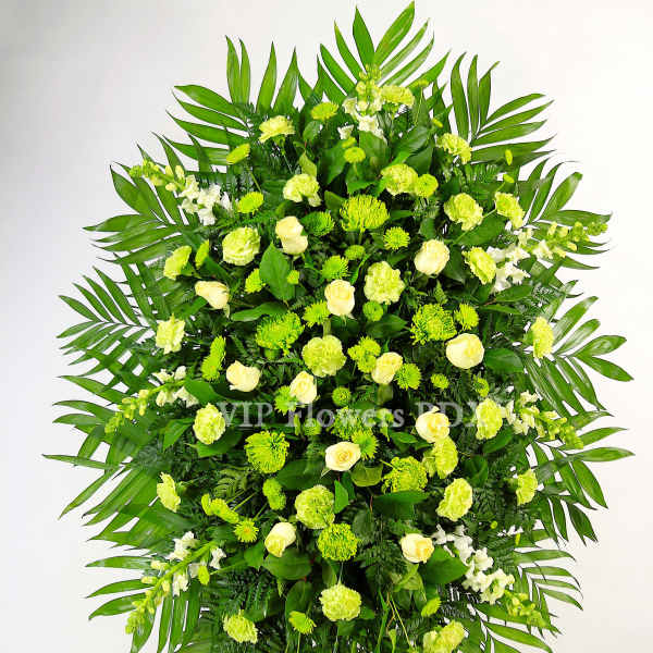 Large standing floral spray with white roses and green flowers