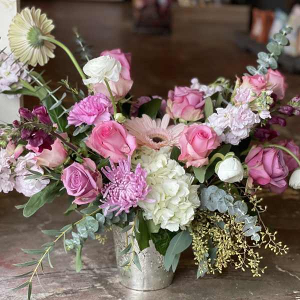 Pink and white mixed flower arrangement in a silver vase