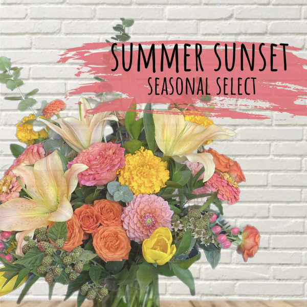 Mixed bouquet with lilies, roses, and bright seasonal blooms