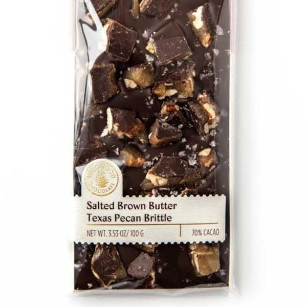 Wrapped chocolate bar with pecan brittle pieces