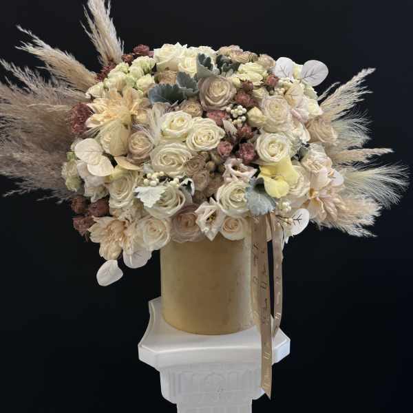 Box of cream and white roses