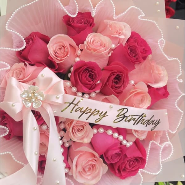 Pink and hot pink rose bouquet with pearls, bow, and a Happy Birthday ribbon.