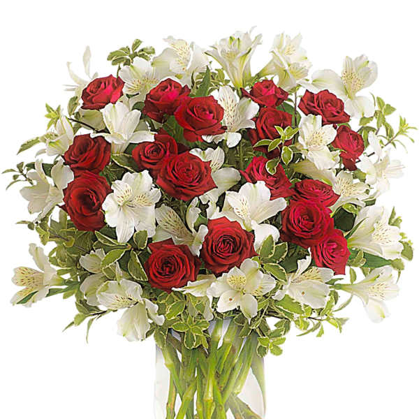 Bouquet of red roses and white alstroemeria in a clear glass vase