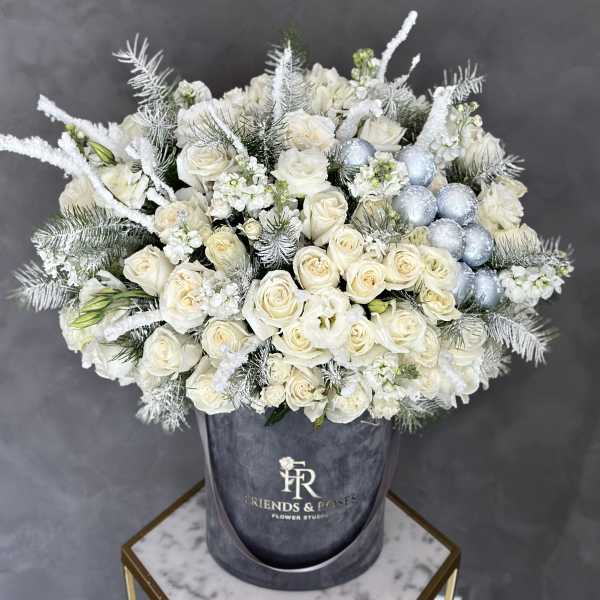 White rose bouquet with silver accents in a gray hatbox