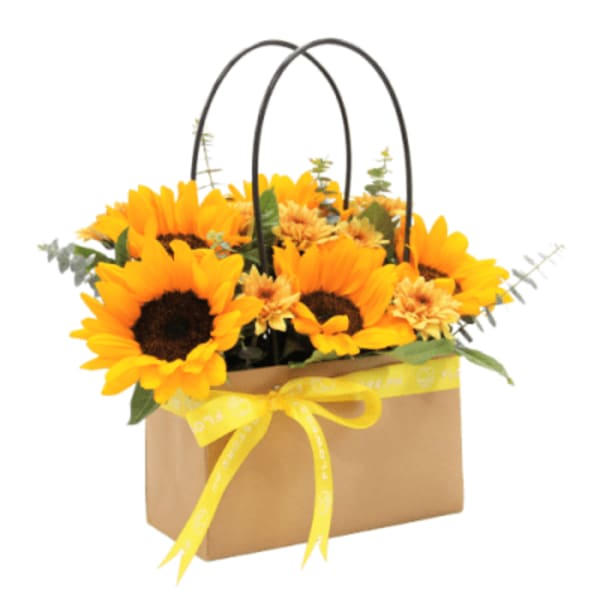 Sunflower arrangement in a brown gift bag with yellow ribbon