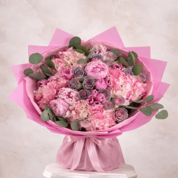 Pink bouquet of hydrangeas and roses with eucalyptus