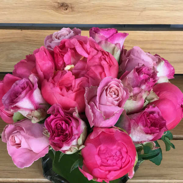 Bouquet of pink roses in a black wrap
