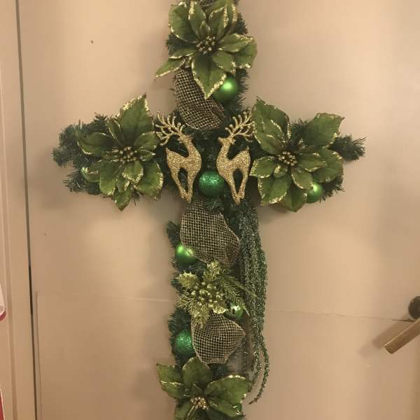 Green Christmas cross with gold ribbon and reindeer ornaments