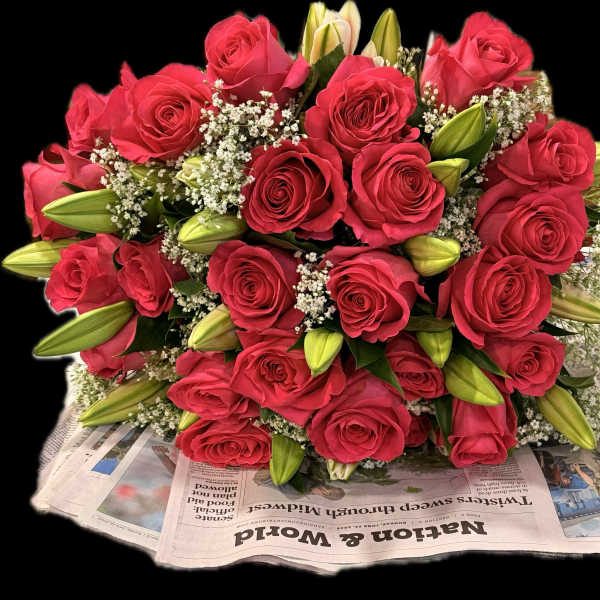 Bouquet of red roses with white filler and lily buds