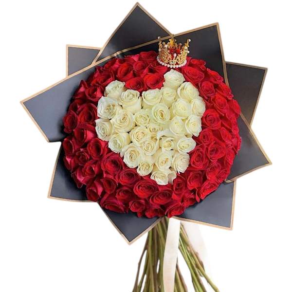 Red and white rose bouquet arranged in a heart shape with a small crown topper