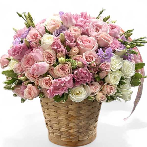 Pink and white rose bouquet in a woven basket