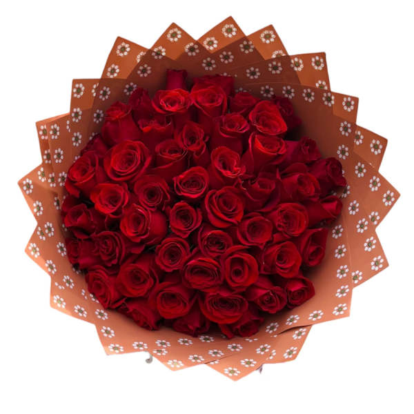 Bouquet of red roses wrapped in patterned orange paper