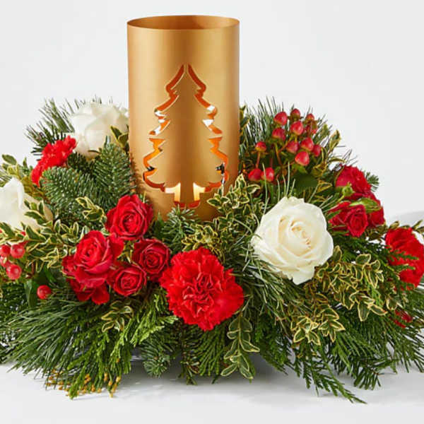 Holiday centerpiece with red and white roses around a gold candle holder