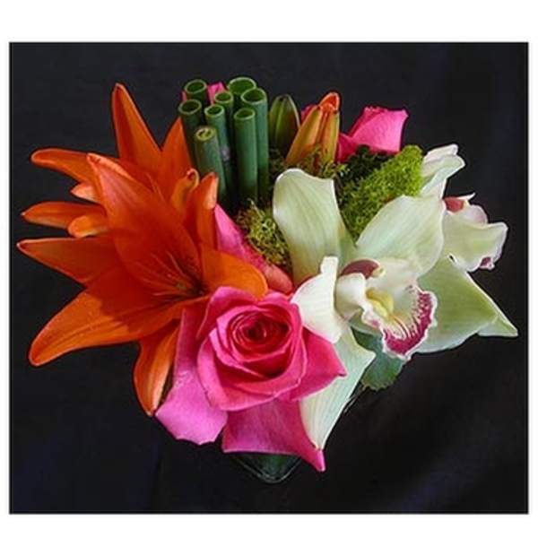 Bright bouquet with orange lilies, pink roses, and white orchids