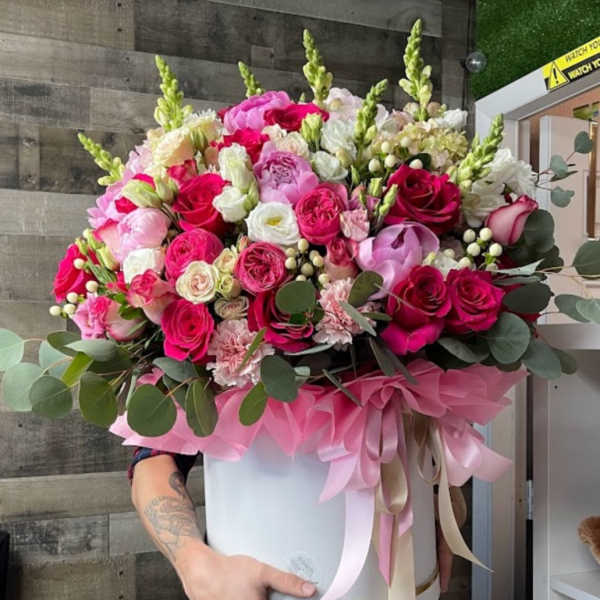Large pink and white rose bouquet in a white hat box