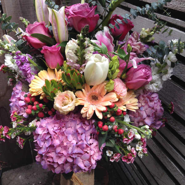 Mixed bouquet with pink roses, lilies, hydrangeas, and gerbera daisies