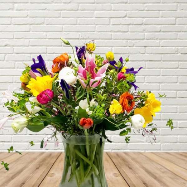 Colorful mixed bouquet in a clear glass vase