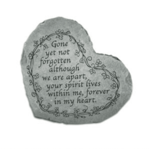 Heart-shaped memorial stone with an engraved remembrance message