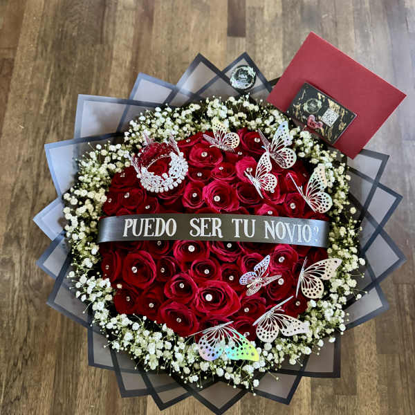 Red rose bouquet with baby’s breath, butterflies, and a silver ribbon